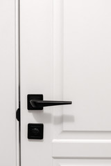 White door with black handle