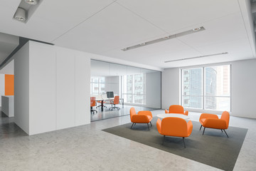 Orange armchairs waiting room in office