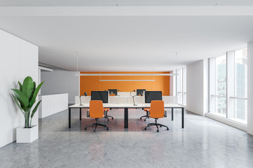 Bright orange and white open space office