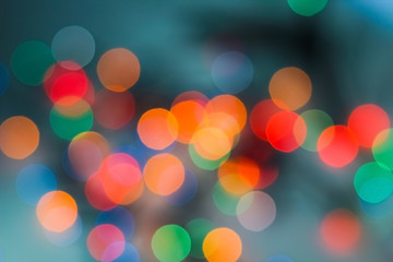 Christmas shiny bokeh garland background. Blurred multicolored texture of new year lights