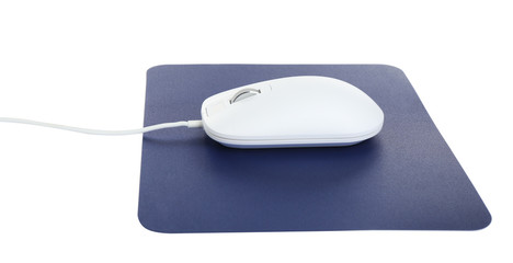 Modern wired optical mouse and blue pad isolated on white