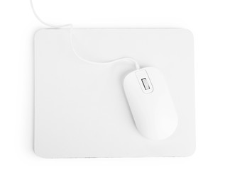 Modern wired mouse and pad isolated on white, top view