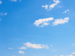 White clouds on a blue sky background