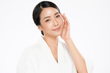 Beautiful young Asian woman touching soft cheek and smile with clean and fresh skin. Happiness and cheerful with, on white background, Beauty and Cosmetics Concept,