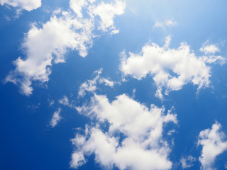 White clouds on a blue sky background