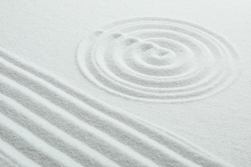 Fototapeta na wymiar White sand with pattern. Zen and harmony