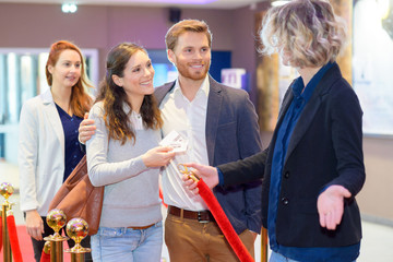 cinema goers queuing for entree