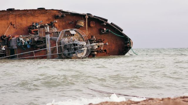 Ecological disaster. The tanker ship crashed and ran aground. Oil pollution of the sea