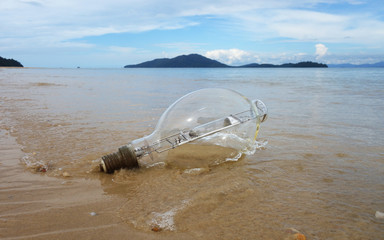 dangerous garbage on the seashore. lamp from a ship thrown to the seashore