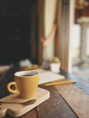 cup of coffee on wooden table
