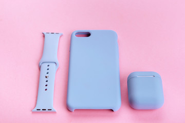 Up to date technology.Top view of diverse personal accessory laying on the pink background