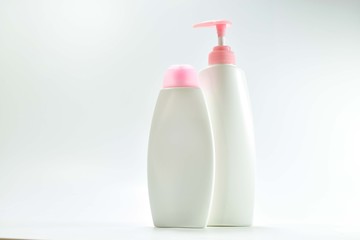 white plastic bottle For lotion, body lotion on a white background.