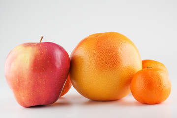 Apples and Orange Isolated on a White Background