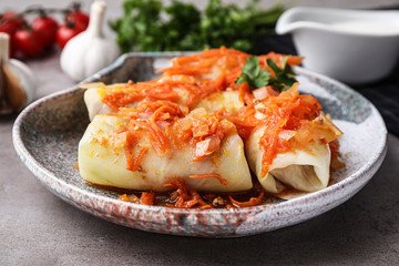 Delicious cabbage rolls served on grey table, closeup