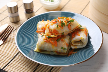 Delicious cabbage rolls served on white wooden table