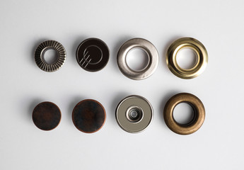 Garment accessories for jeans isolated on white, top view