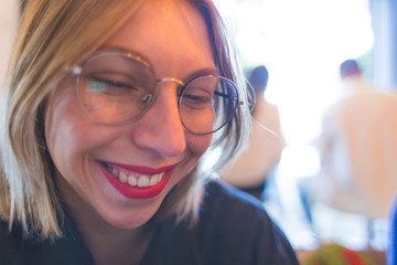 Portrait of a blonde in glasses.