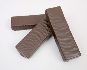 Chocolate glazed wafers on a gray structural background