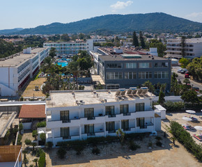 Aerial view on Mediterranean beach and small coastal hotel. Rhodes Greece.