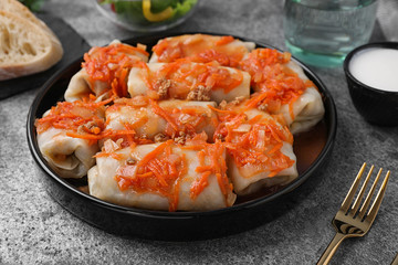 Delicious cabbage rolls served on grey table, closeup