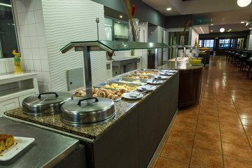 interior of the restaurant of the resort European hotel is all inclusive, large hall with tables waiting for their guests