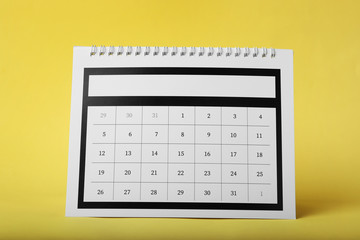 Paper calendar on yellow background. Planning concept