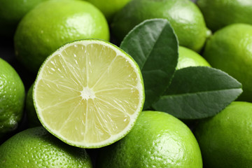 Fresh ripe juicy limes as background, closeup