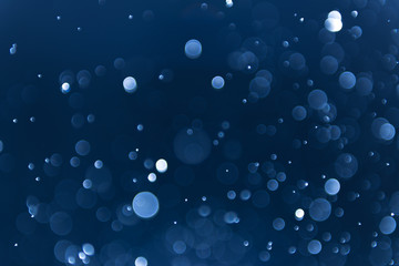 abstract sparkle bokeh light effect with navy blue background