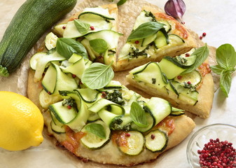 Vegetarian pizza with zucchini, mozzarella and basil