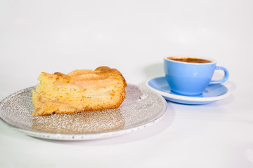 Charlotte of pears and cappuccino on a white background