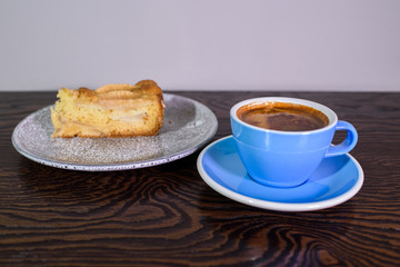 Charlotte of pears and cappuccino on a white background
