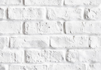 Close-up of vintage white brick wall indoor .