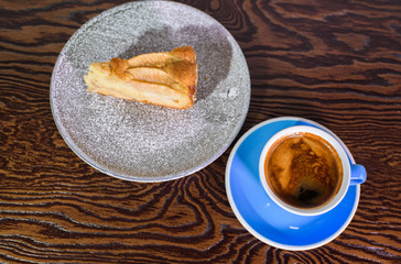 Charlotte of pears and cappuccino on a white background