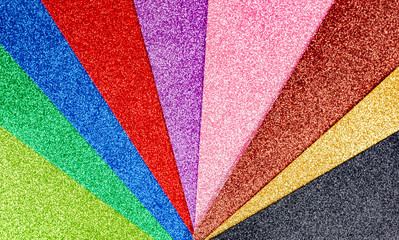 Rainbow sparkles background . Celebration decoration backdrop. Top view, copyspace .