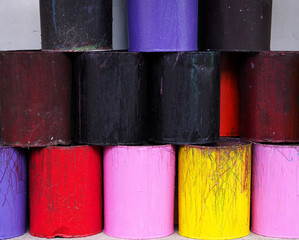 Colorful cans paints brush palette background.
