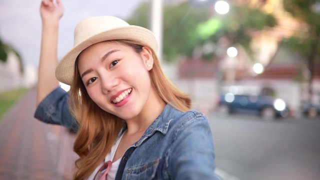Traveler Asian blogger women travel in Bangkok, Thailand, beautiful female using mobile phone make vlog and live in social media .woman tourist making video call with smartphone while traveling. .