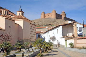 Fototapeta na wymiar View of the castle, built 1509 - 1512, (Castillo de La Calahorra) and town, La calahorra, Granada Province, Andalucia, Spain