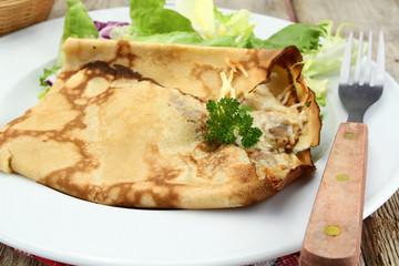pancakes with ham and cheese on a plate