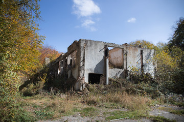 Autumn forest and old soviet building. Azerbaijan Ganja