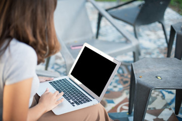 Close up Asian freelance girl working with a laptop.