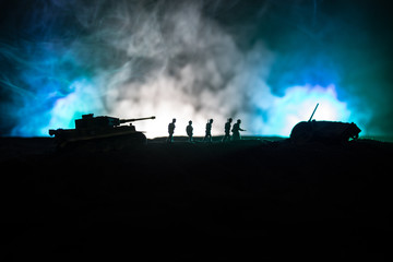 War Concept. Military silhouettes fighting scene on war fog sky background, World War German Tanks...