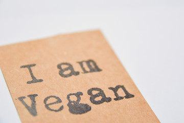 I am Vegan label on a white background. Brown paper label, black letters and lots of copy space