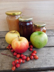 Three jars of homemade jam with apple and rose hips
