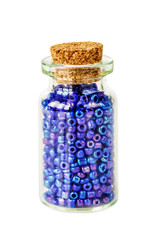 Blue beads in small glass jar