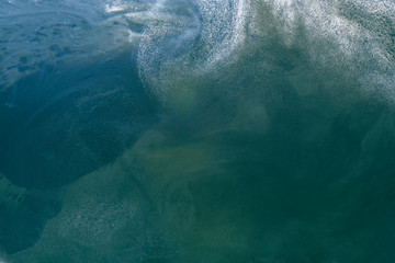 Fototapeta premium Abstract liquid green ocean background with bubbles. Fresh underwater backdrop