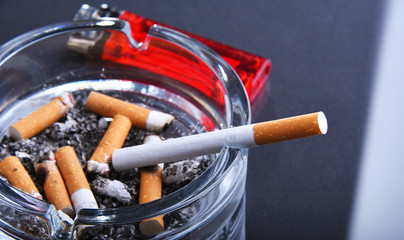 Ashtray and cigarettes. Tobacco smoking.