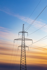 Power line silhouette on sunset background