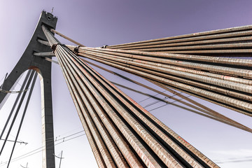 Obraz premium Road bridge construction - metal cables and reinforced concrete supports,