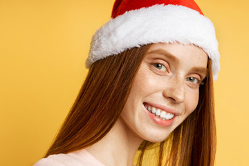 Beautiful caucasian female model wearing santa hat