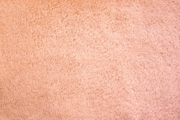 Beige pink fur texture backgrounds. Concept of warmth and comfort, winter cloth